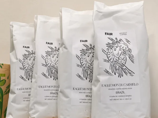 Bags of specialty coffee lined up on the shelf at Upendo.